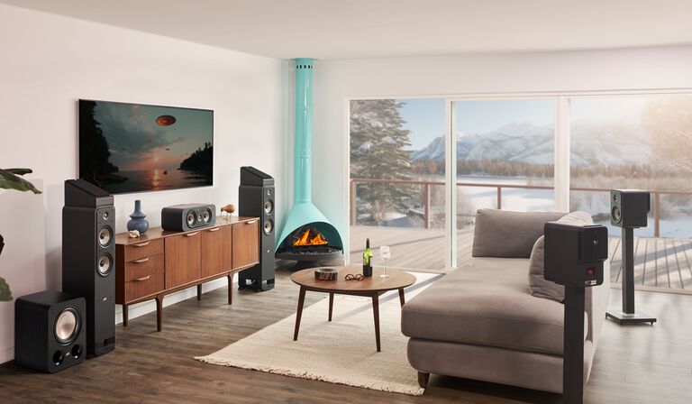 A couple dancing with music from a sound bar.