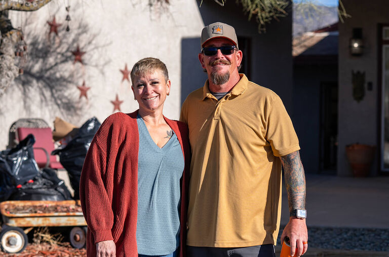 Matt and Virgina standing outside their home