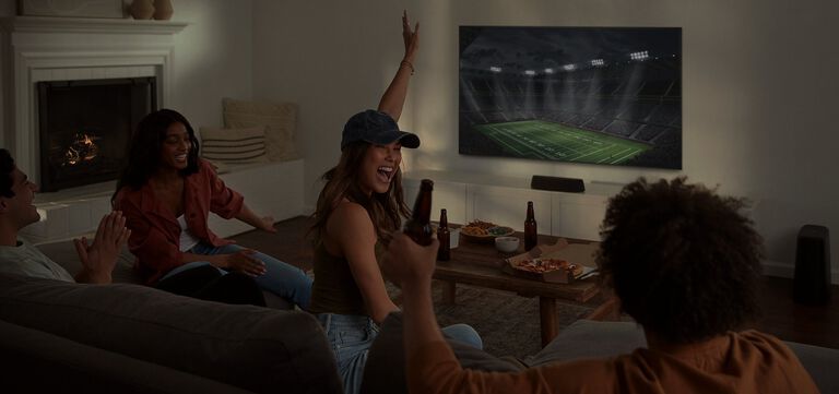 Woman excited watching sports on tv